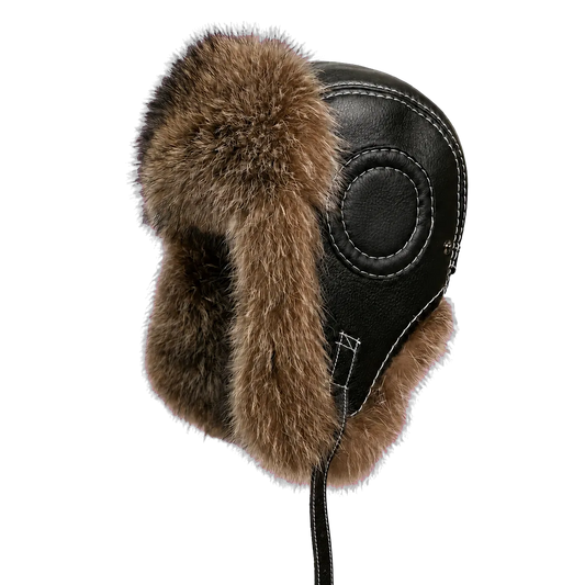 Genuine raccoon dog fur and black sheepskin leather trapper hat isolated on a transparent background