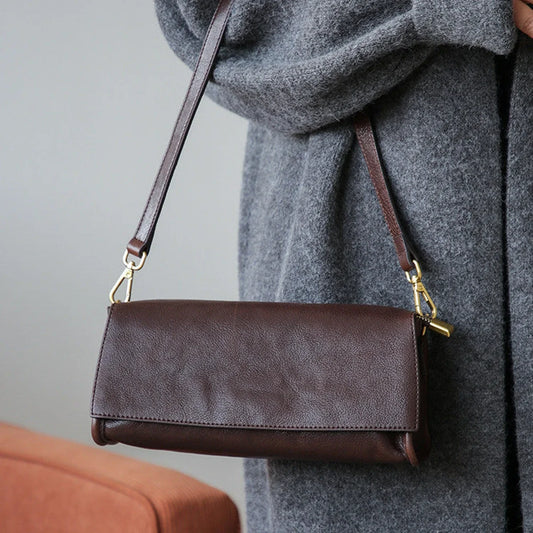 Coffee brown leather baguette bag full shoulder view