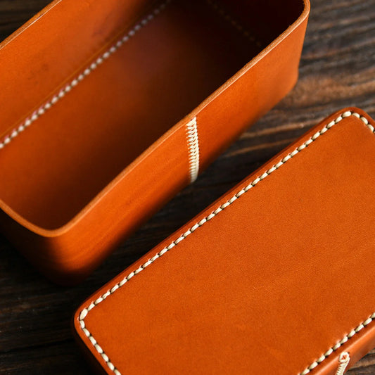 Open leather storage box showing the rectangular interior compartment