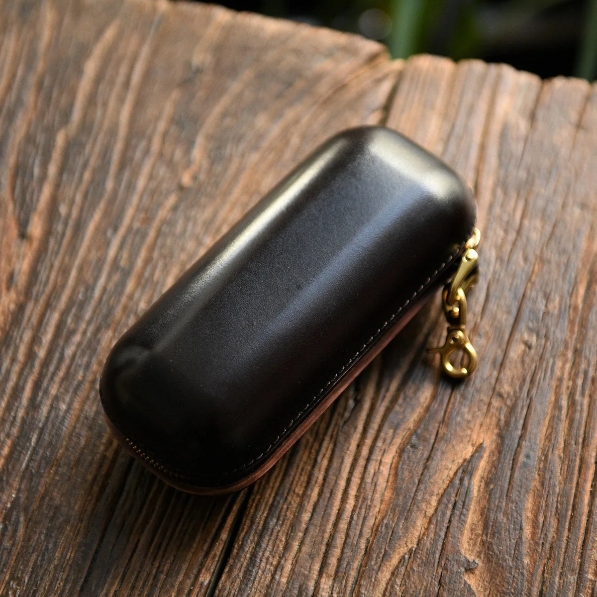 Small dark brown vegetable-tanned leather eyeglass case