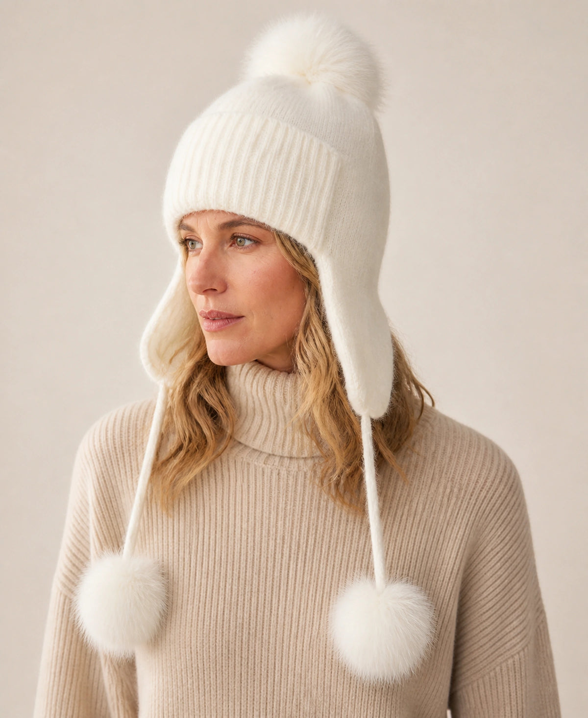 Women's Fox Fur Pom-Pom Knit Earflap Trapper Hat – Color: White on-model lifestyle image