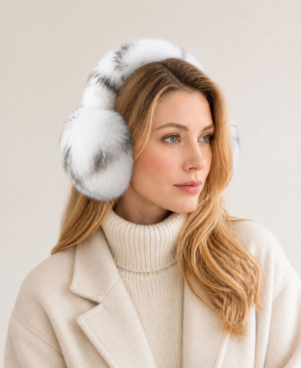 Women's Golden Island Fox Fur Winter Earmuffs – Color: White Leopard on-model lifestyle image