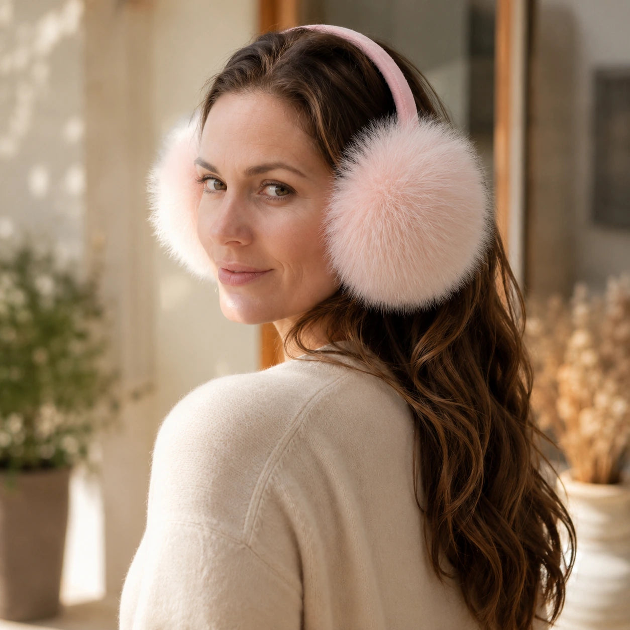 Soft blush genuine fox fur earmuffs viewed from the side