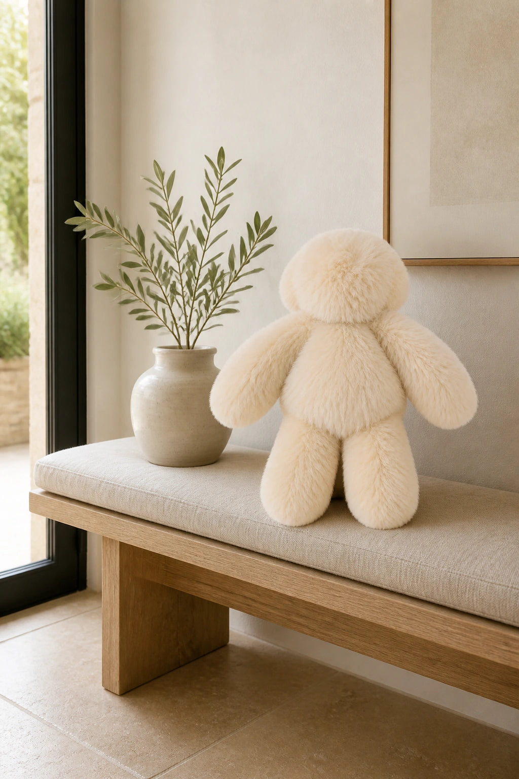 Warm cream genuine rabbit fur bunny styled as a quiet entryway accent
