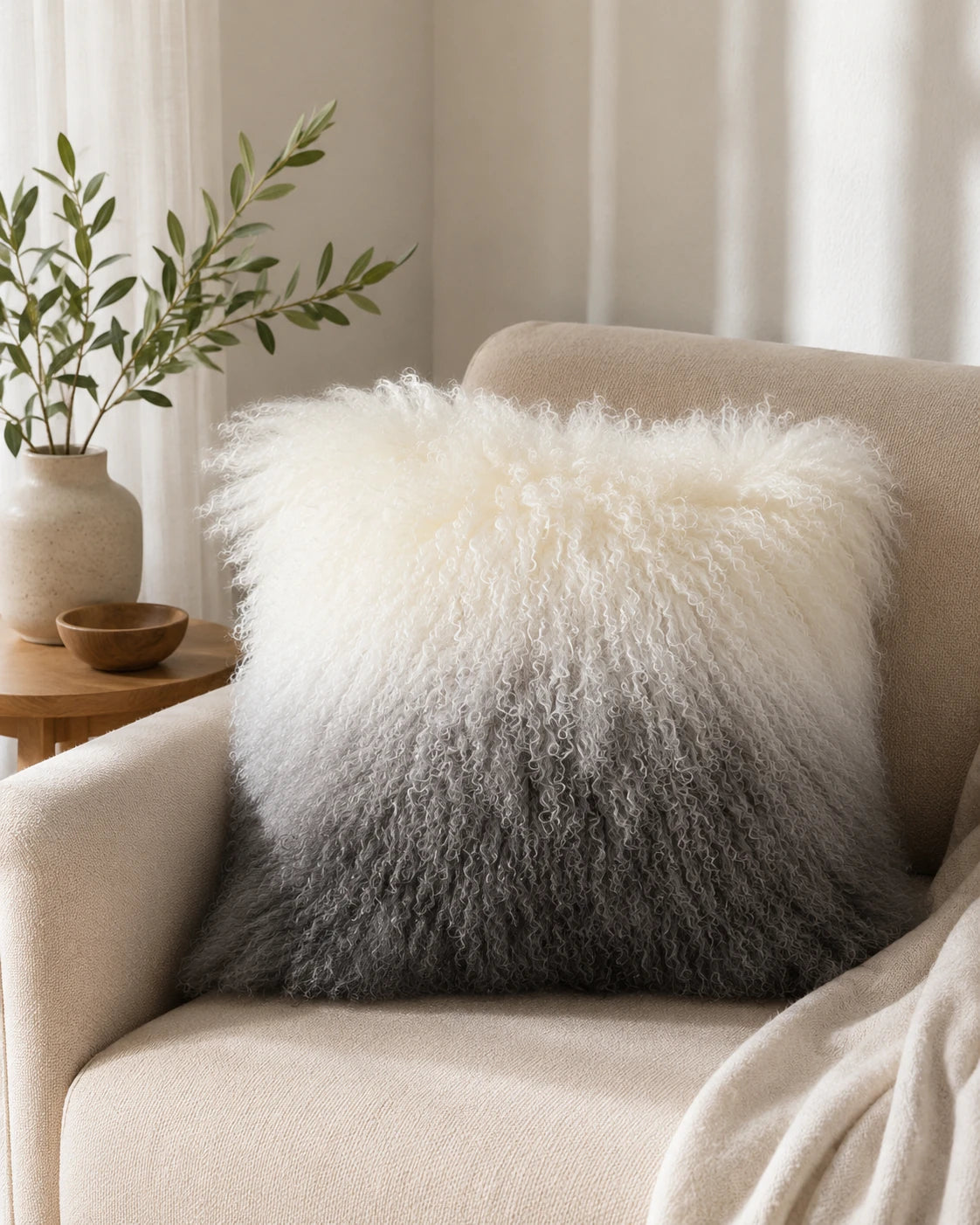 Capricornus Living Gray Gradient lamb wool pillow styled in a sofa corner