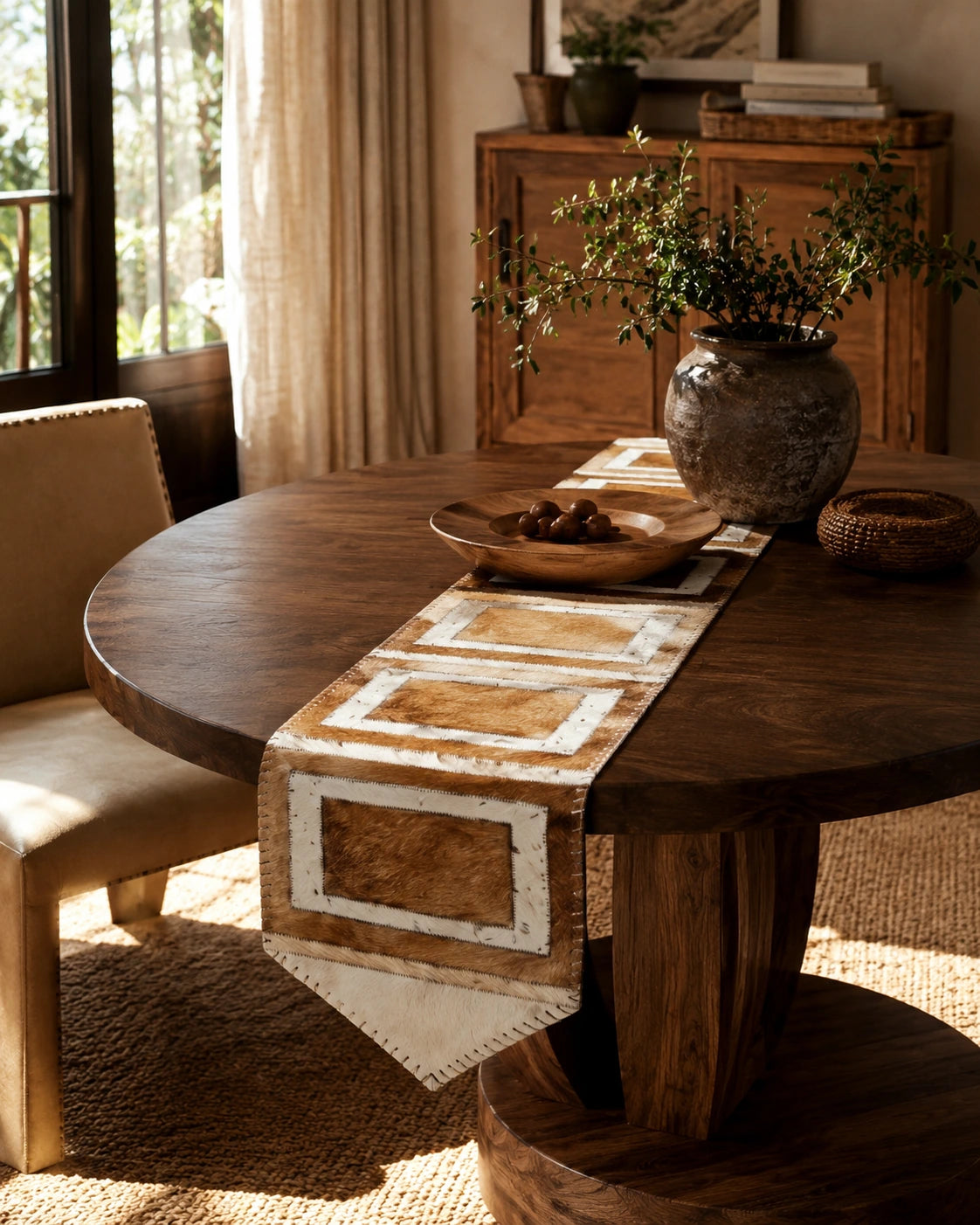 Capricornus Living Random Golden Geometric cowhide table runner styled on a round table