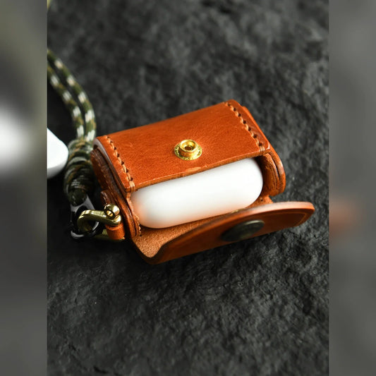 Sunset Tan hand-stitched cowhide earbud case shown open