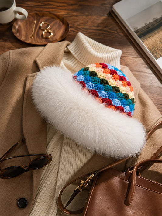 White fox fur-trim geometric knit bucket hat styled with a neutral winter outfit