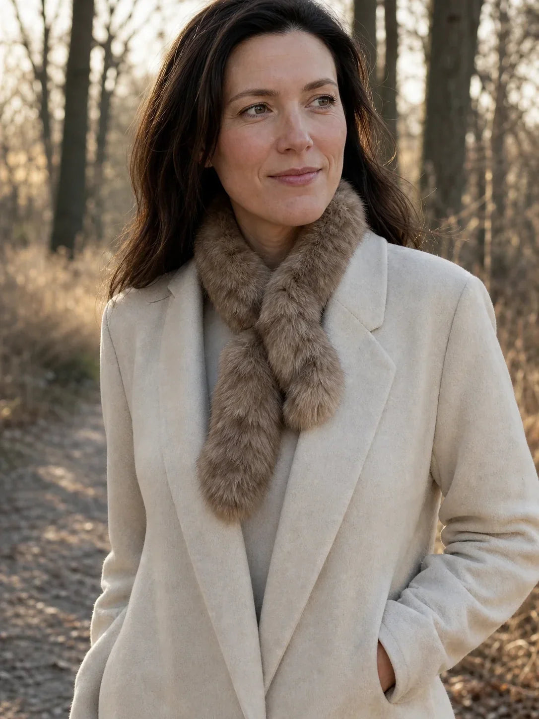 Light Brown sable fur mini scarf styled with an ivory coat outdoors