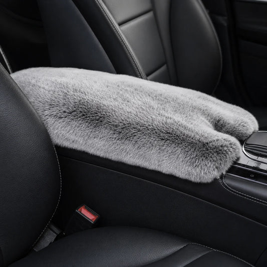 Silver gray genuine Rex rabbit fur center console armrest pad installed in a black car interior