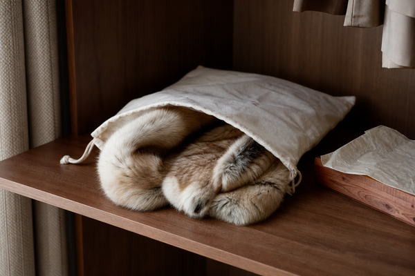 Fur accessory stored loosely in a breathable cotton bag