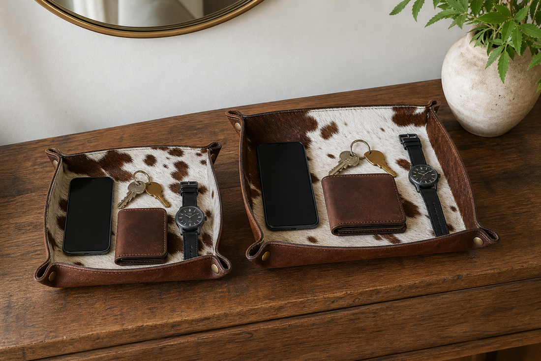 Fifteen by twenty and twenty by twenty-five centimeter cowhide valet tray templates filled with everyday carry items