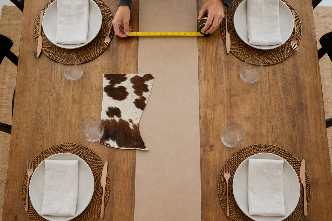 Dining table measured with a centered 30 centimeter runner lane and full place settings