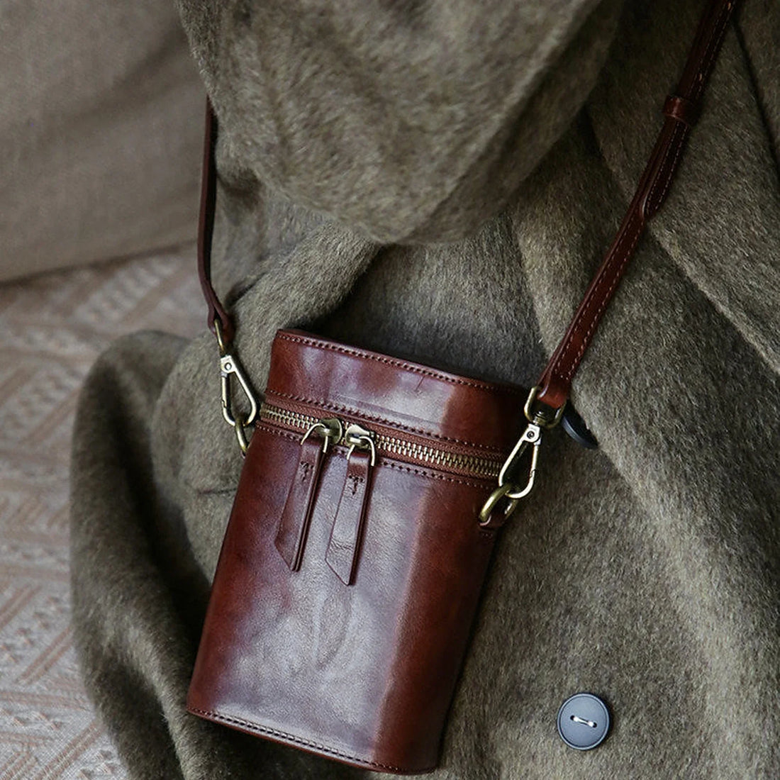 Vegetable-tanned cowhide vertical phone crossbody bag styled in warm brown