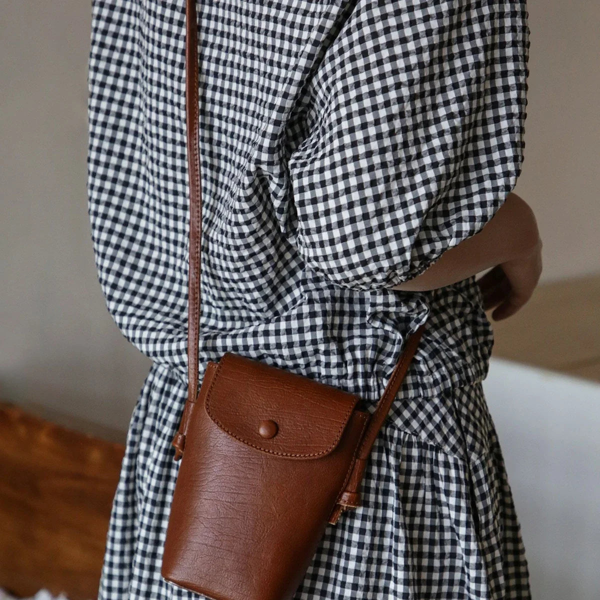 Women's brown top-grain cowhide phone crossbody bag with flap closure