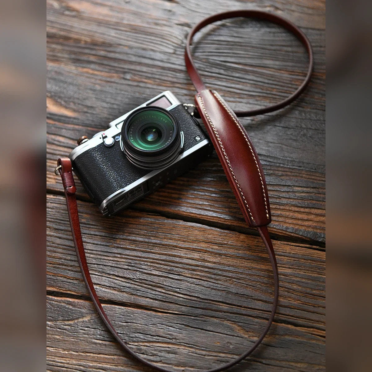 Vegetable-tanned cowhide camera shoulder strap in use
