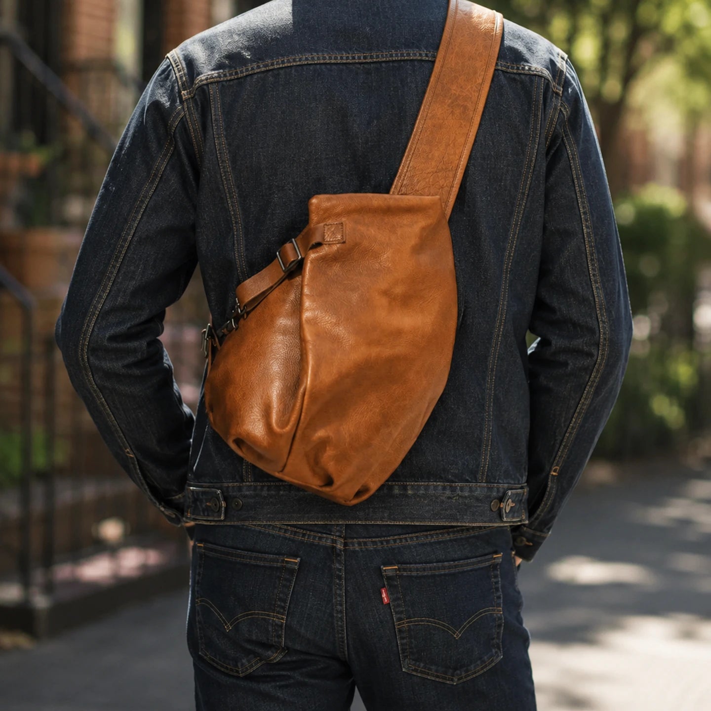 First-layer cowhide leather sling chest bag in Vintage Brown, worn crossbody