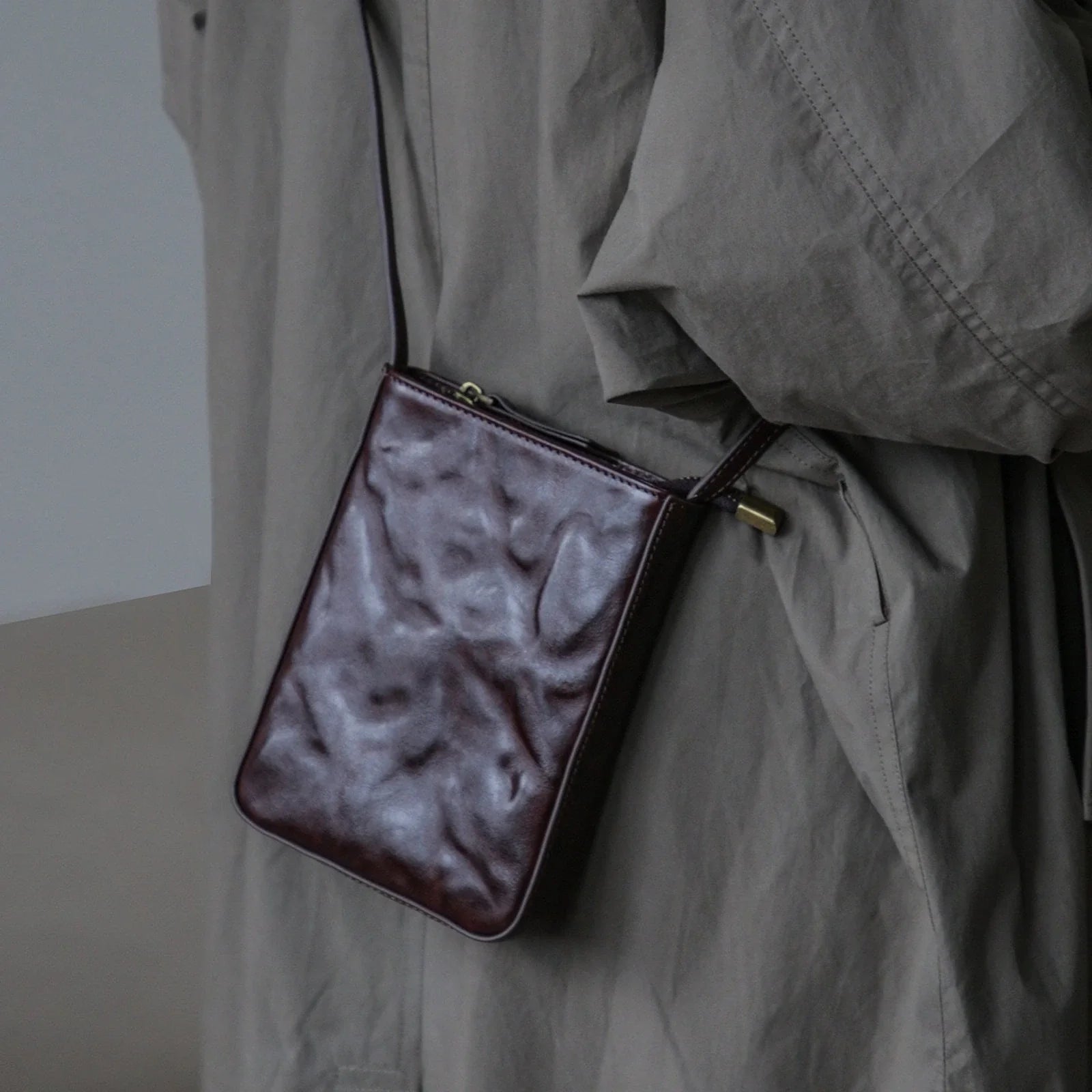 Ebony Coffee top-grain leather phone crossbody bag, worn view