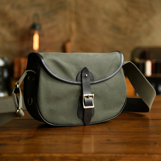 Olive green waxed canvas padded camera crossbody bag front view