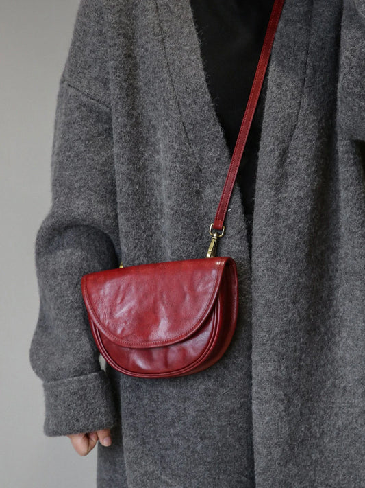 Vintage red top-grain cowhide saddle bag worn crossbody