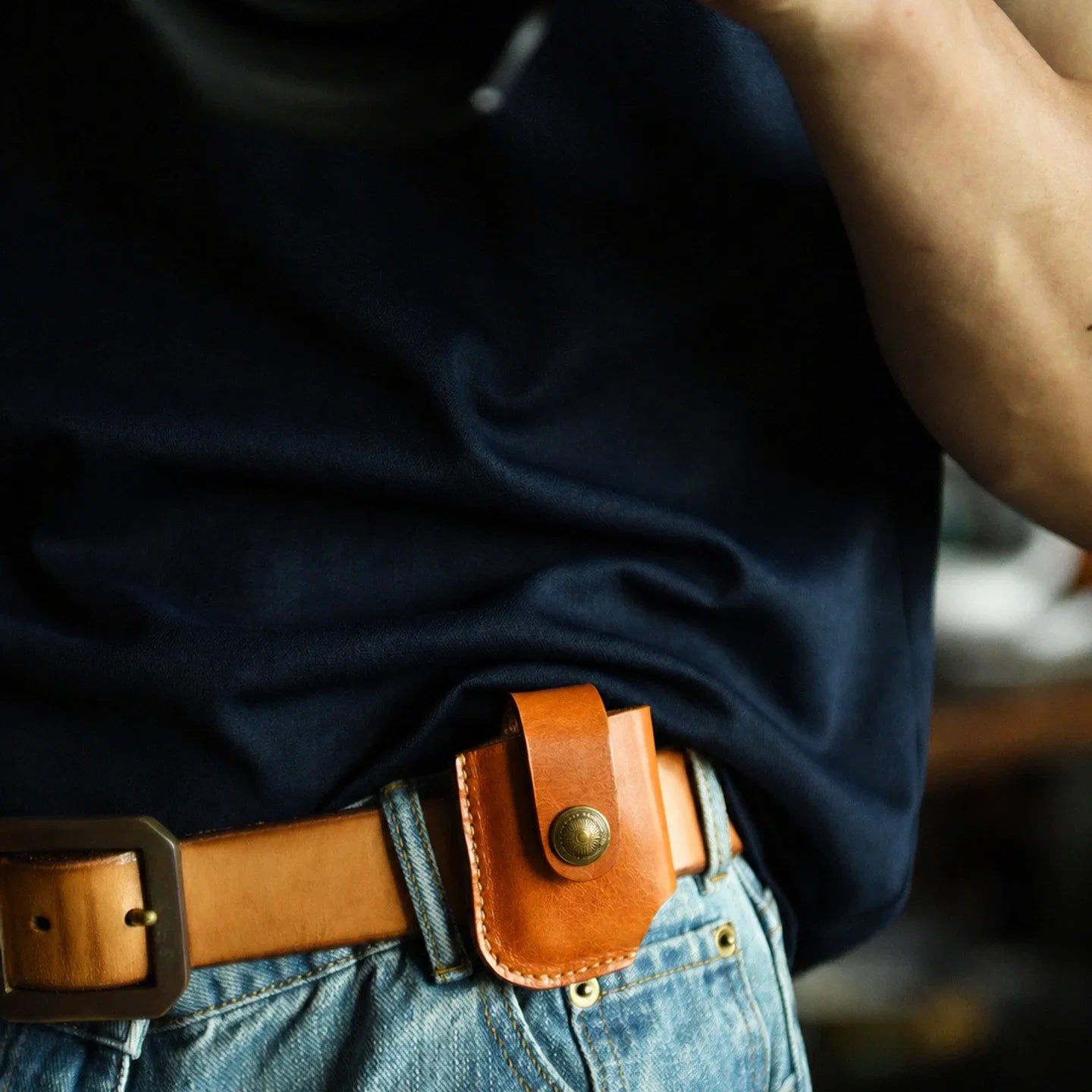 Sunset yellow top-grain leather lighter case worn on a belt