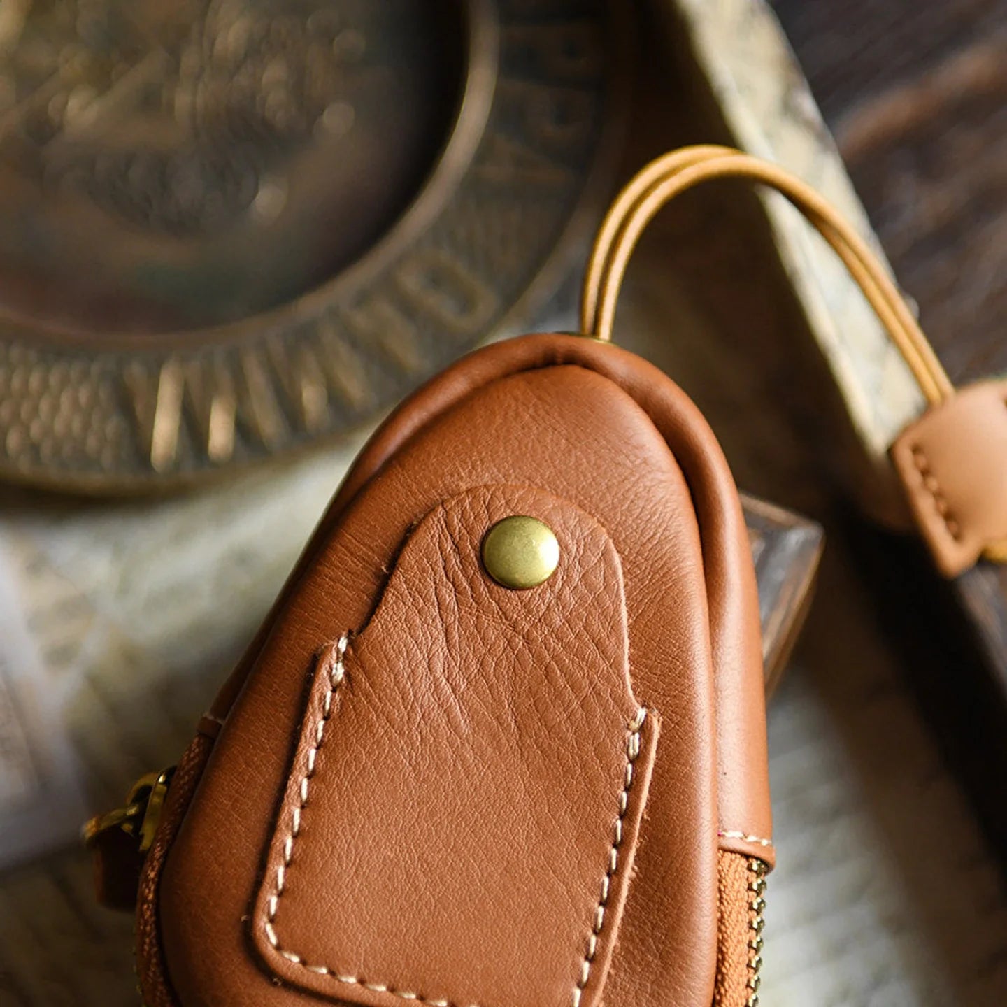 Top-grain leather car key case in a warm vintage setting