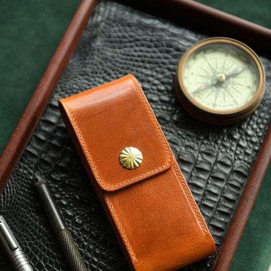 Vegetable-tanned leather fountain pen case in a refined desk setting
