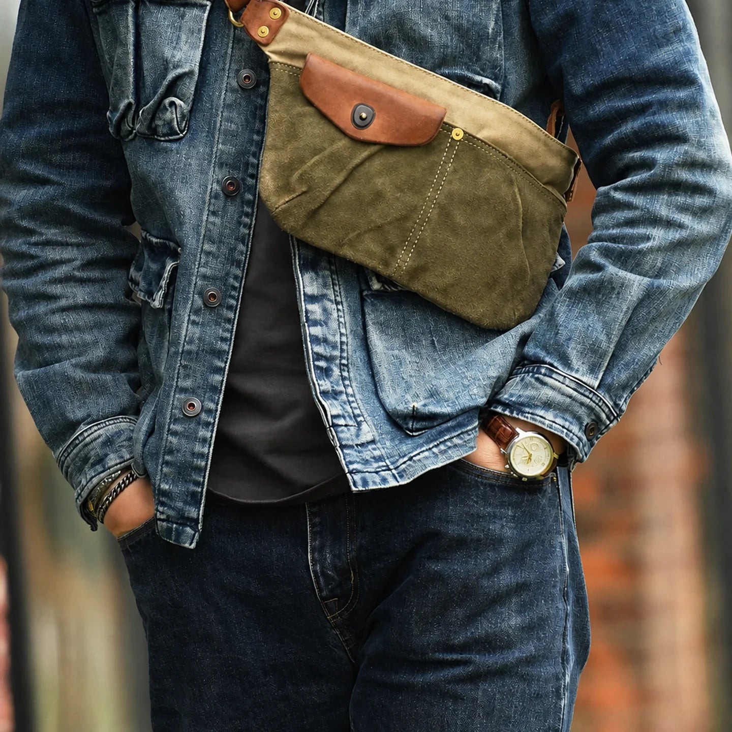Army green vintage canvas sling bag worn across the chest