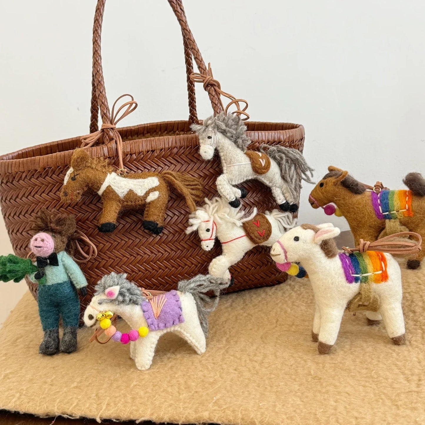 Handmade wool felt horse charms styled together