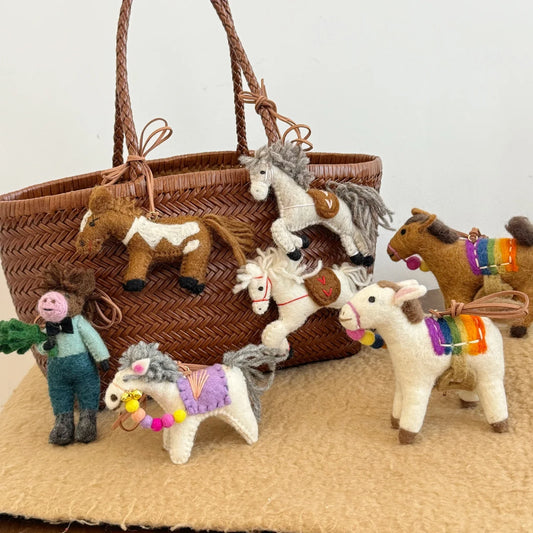 Handmade wool felt horse charms styled together