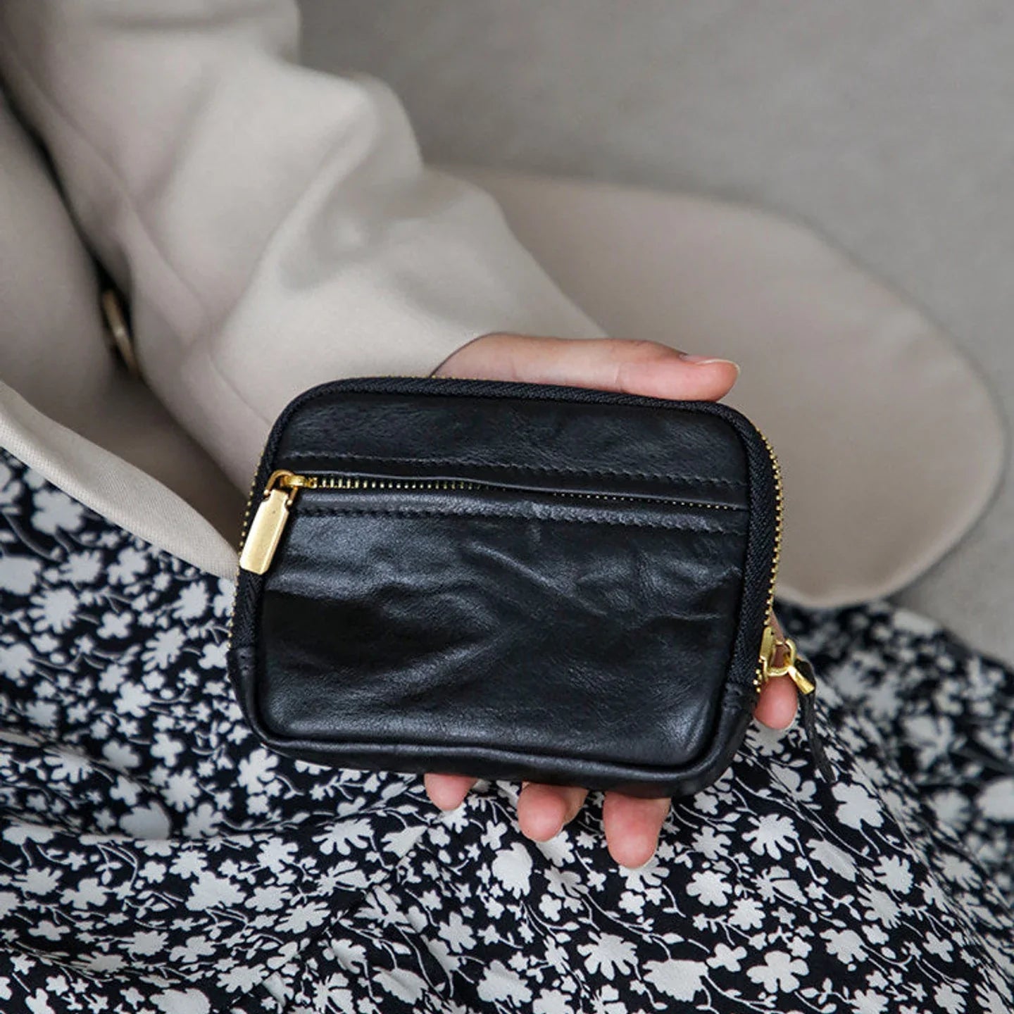 Women's black top-grain cowhide coin wallet with horizontal zip design