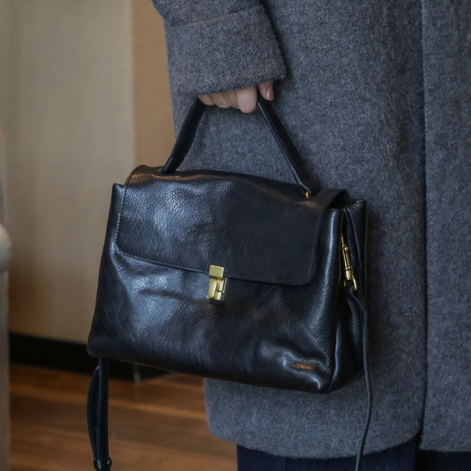 Black vegetable-tanned top-grain leather tote bag, front view