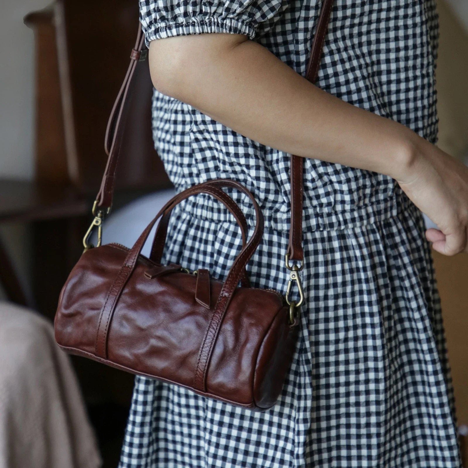 Coffee Brown vegetable-tanned leather mini barrel bag worn on the shoulder