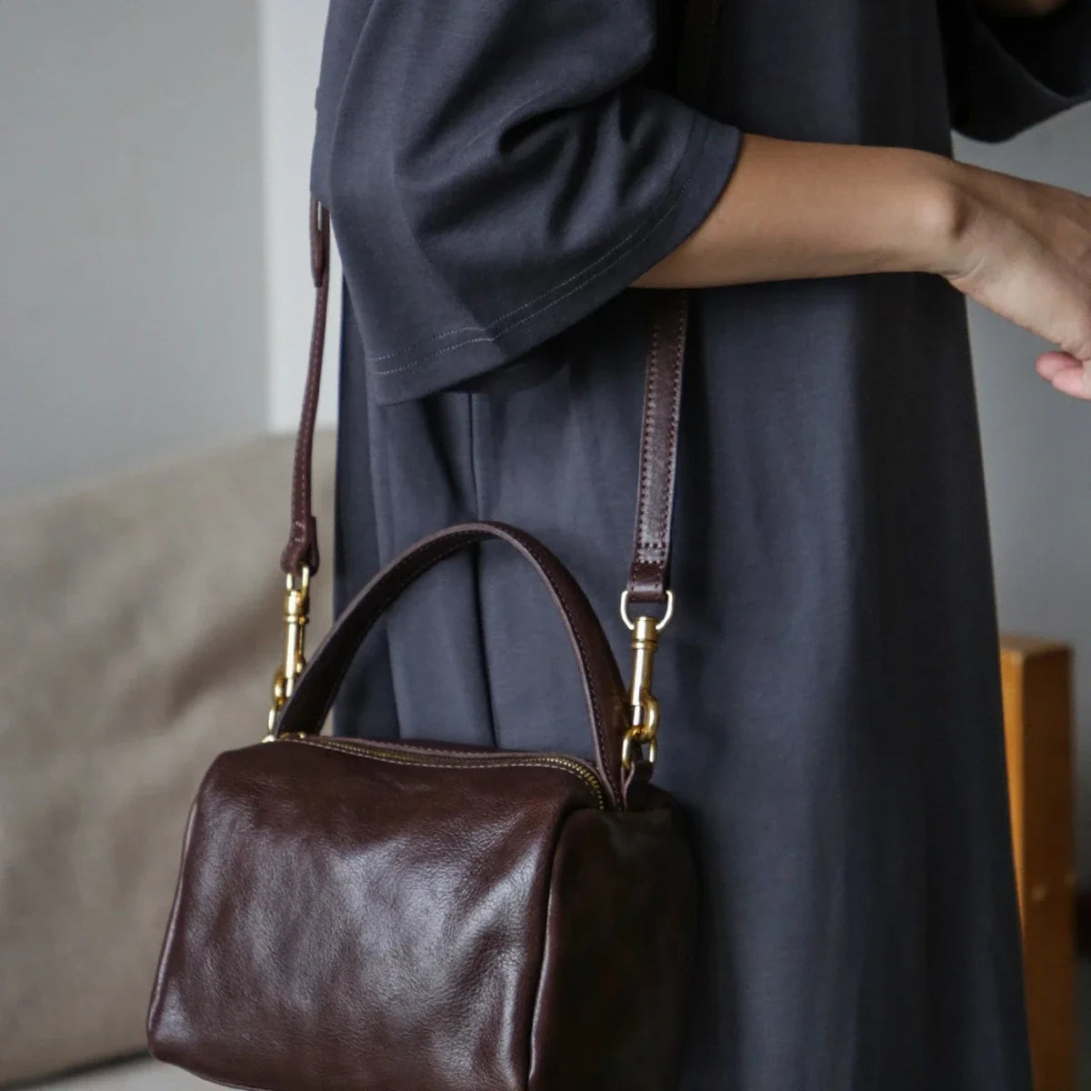 Women's coffee brown leather square bag worn crossbody