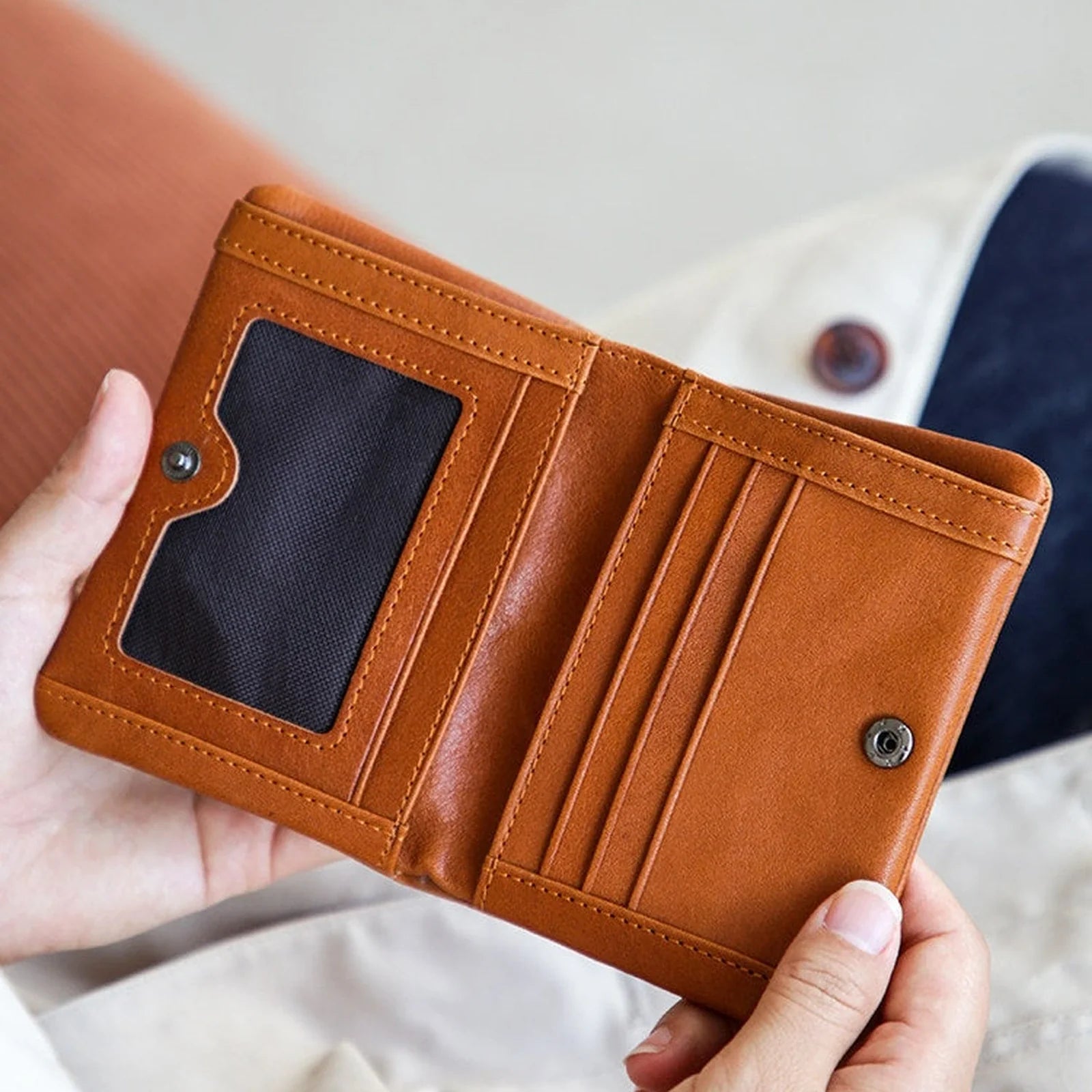 Cognac leather short wallet open with card slots and ID window