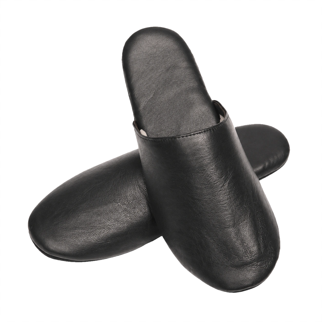 Black lambskin travel slippers crossed pair on a transparent background