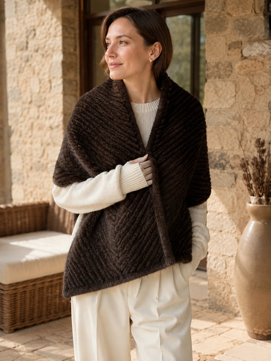Woman styling a Dark Brown genuine mink fur scarf indoors