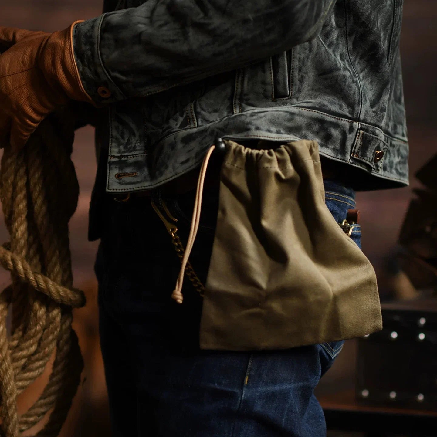 Canvas drawstring utility pouch worn at the waist