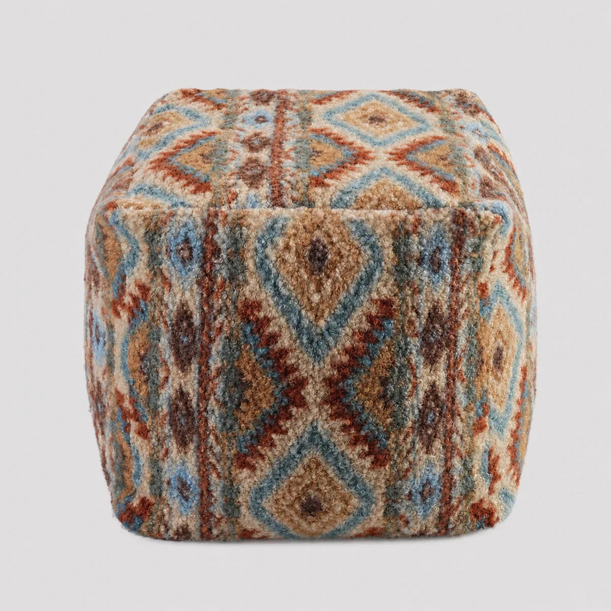 Fair Isle geometric textured floor cushion on a light neutral background