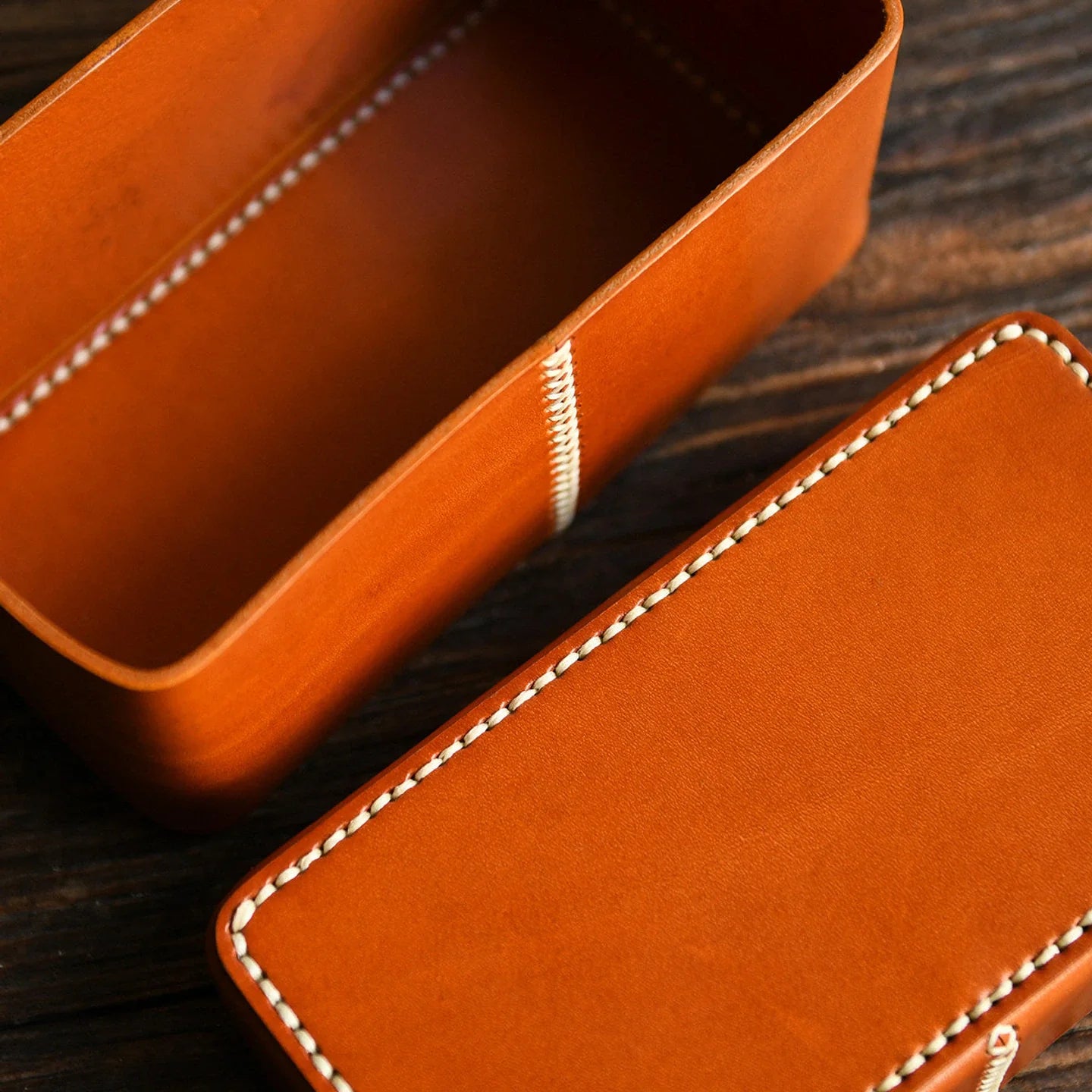 Open leather storage box showing the rectangular interior compartment
