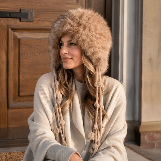 Natural Sable genuine sable fur earflap hat worn in a winter doorway