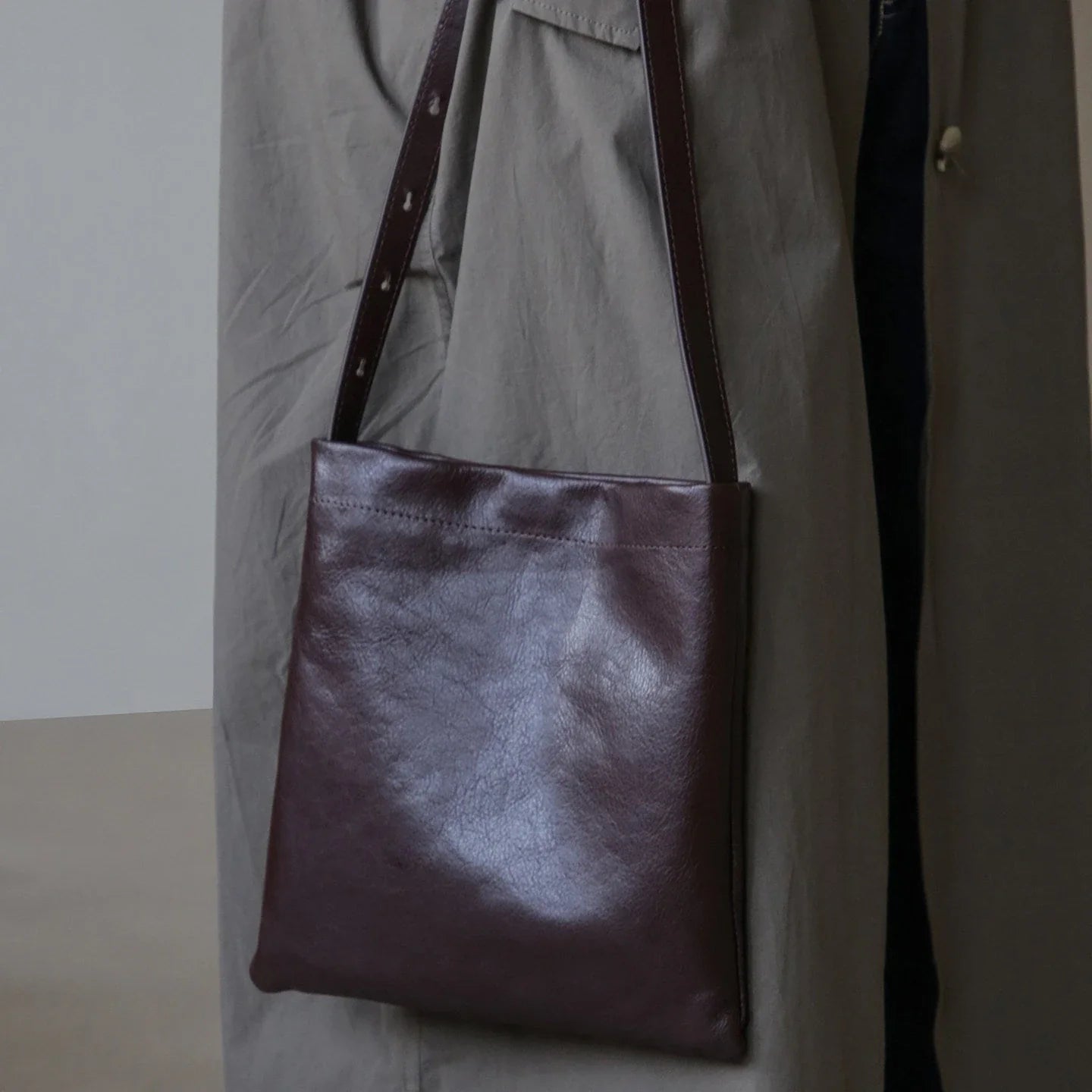 Front view of the ebony brown top-grain leather shoulder bag