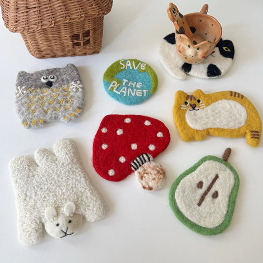 Colorful handmade wool felt animal, fruit and mushroom coasters