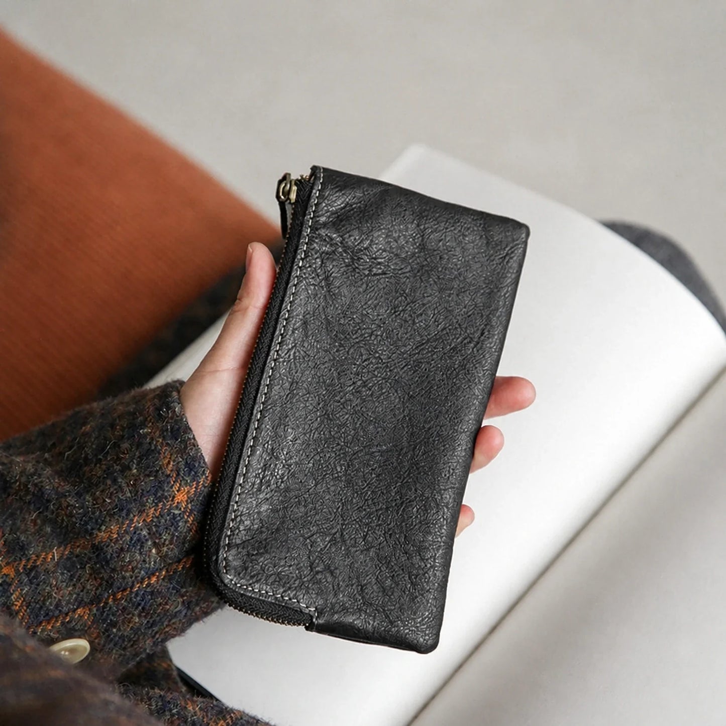 Black top-grain leather long wallet, front view