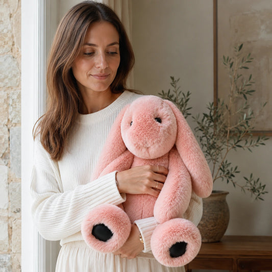 Blush Pink genuine Rex rabbit fur lop bunny doll styled in a quiet home interior