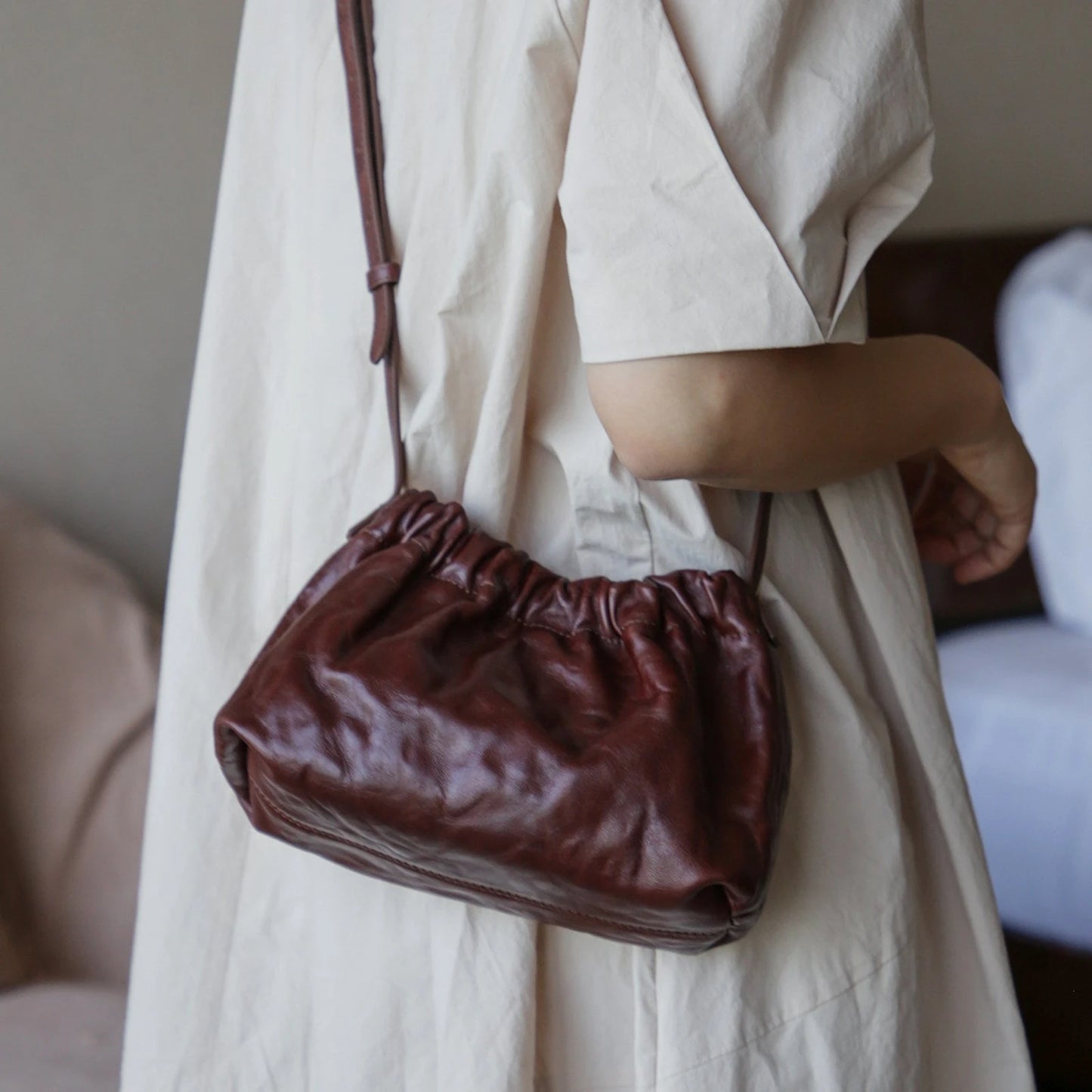 Dark brown gathered leather shoulder bag side view