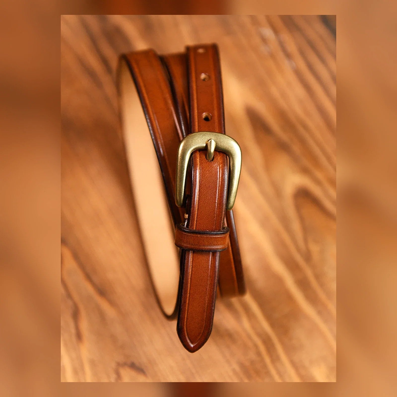 Brown top-grain leather slim belt with warm metal buckle