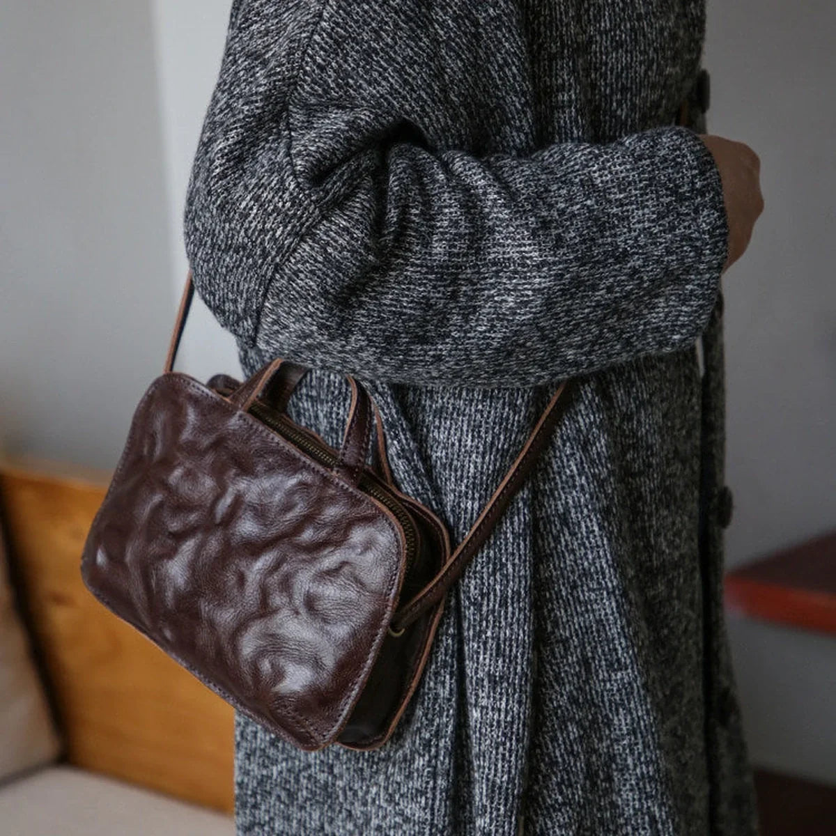 Coffee brown crinkled cowhide mini bag shown from the side