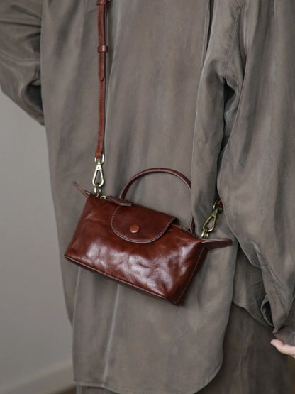 Coffee brown vegetable-tanned leather mini bag worn crossbody