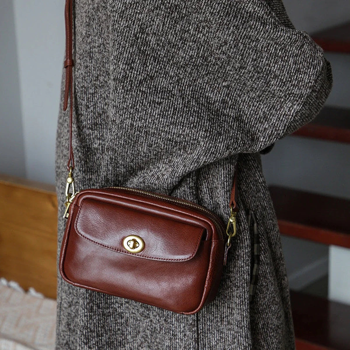 Coffee brown leather crossbody bag styled at the side